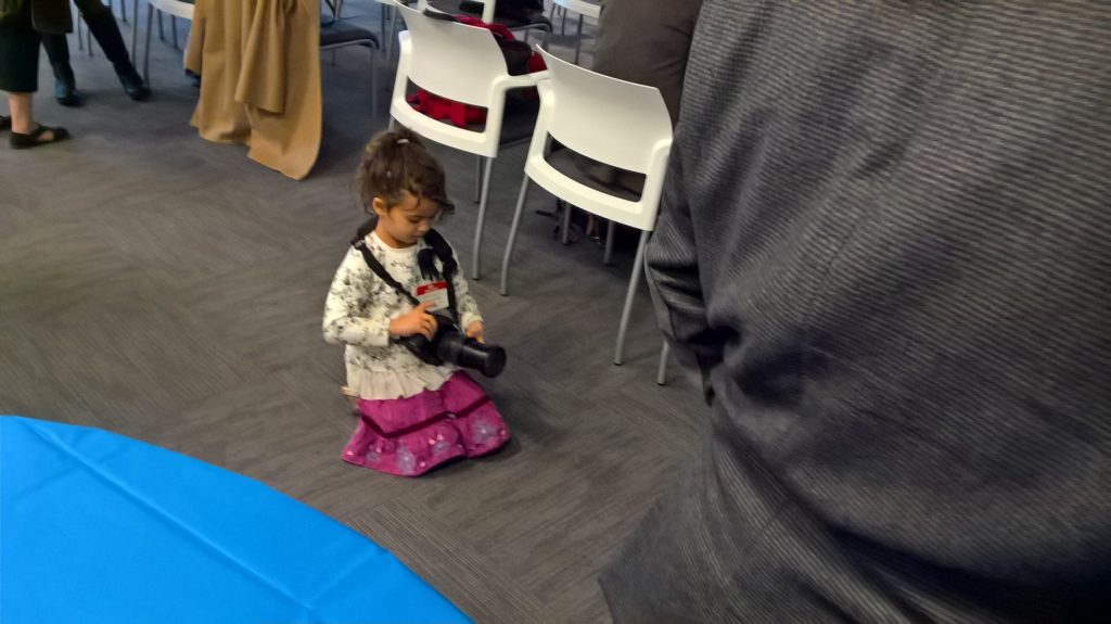 The TR Anniversary Party is a family affair. Here's my 5-year-old, who gamely snapped a photo of her Dad with Phil Sharp. She was well-behaved, enduring Dad's "boring, boring, boring" biotech event.